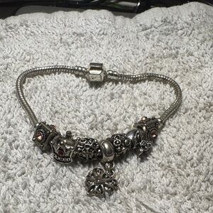 Silver Charm Bracelet with Intricate Details Hanging Heart Charm